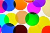 Dichroich filters  used in lighting to color the light or correct the color temperature.